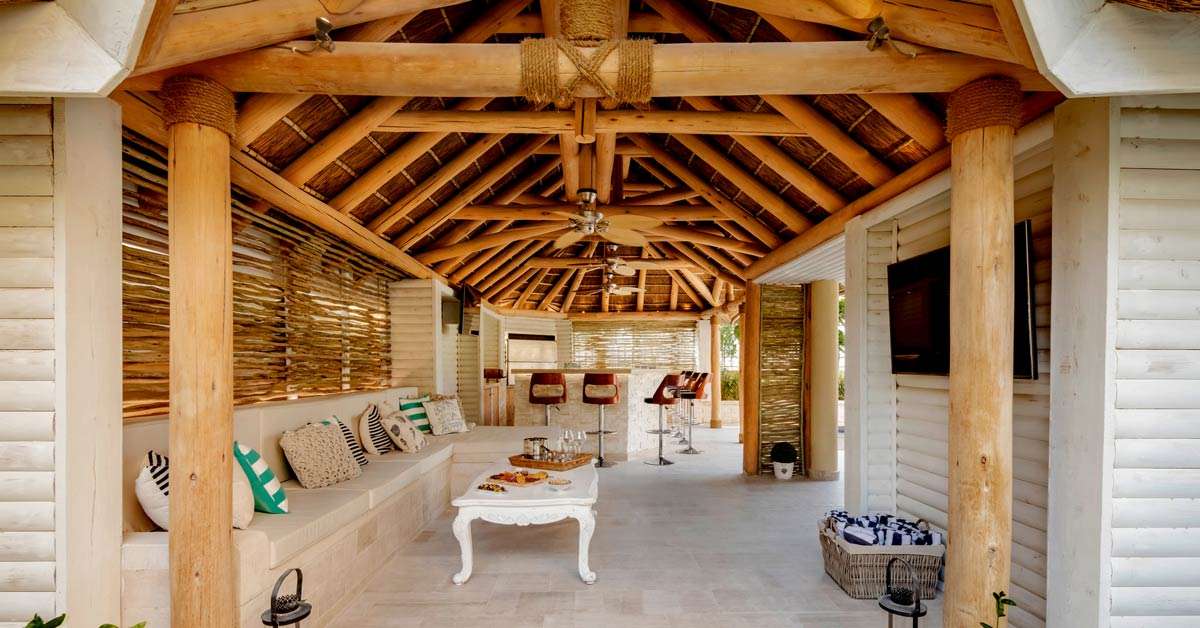 Thatched roof entertainment area with natural eucalyptus substructure