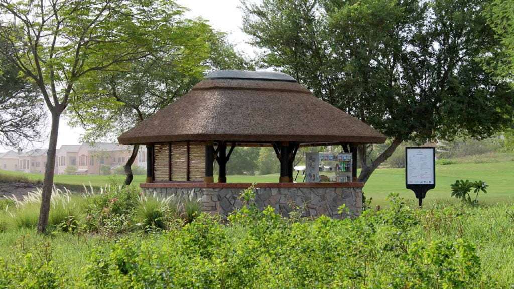 Thatched halfway house with lath screen