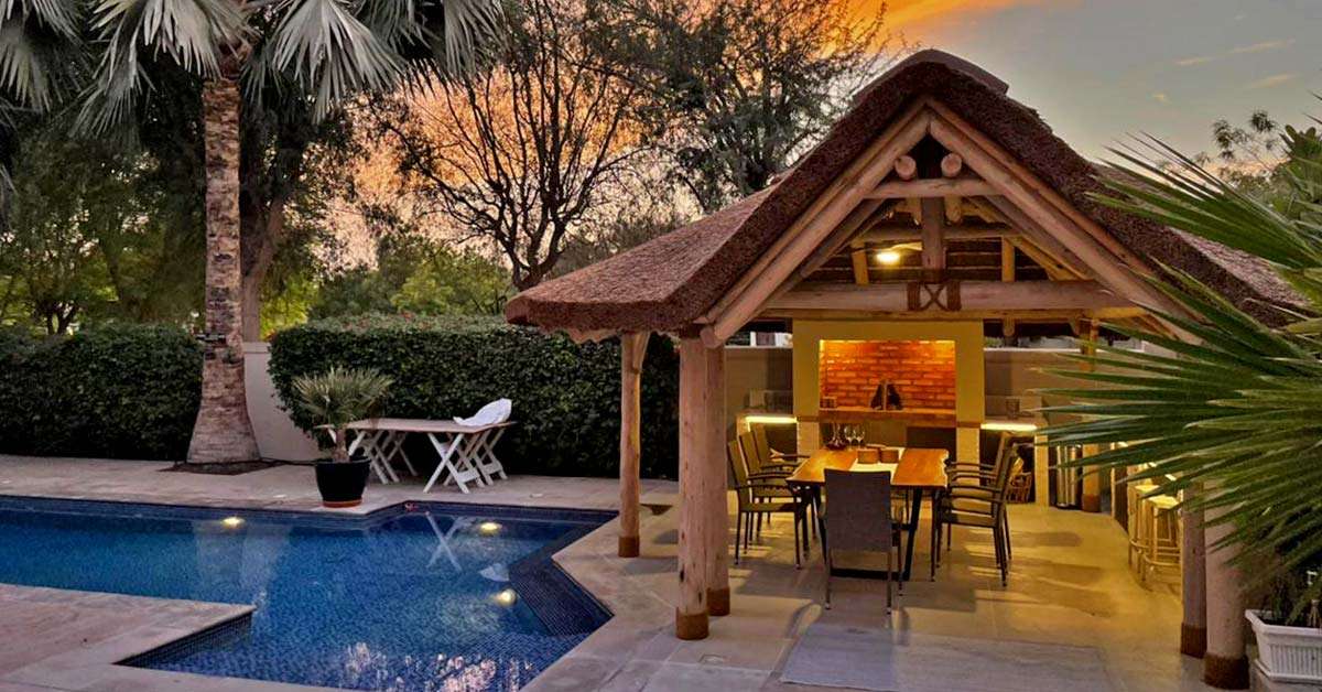 Beautiful outdoor living space with a thatched roof