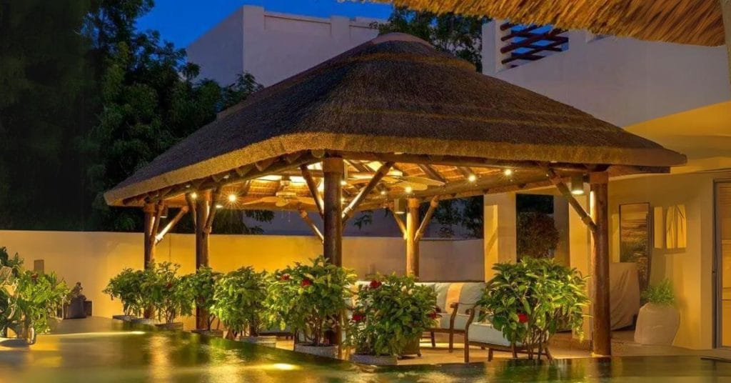 Cape Reed poolside thatched roof gazebo, perfect for outdoor entertaining.