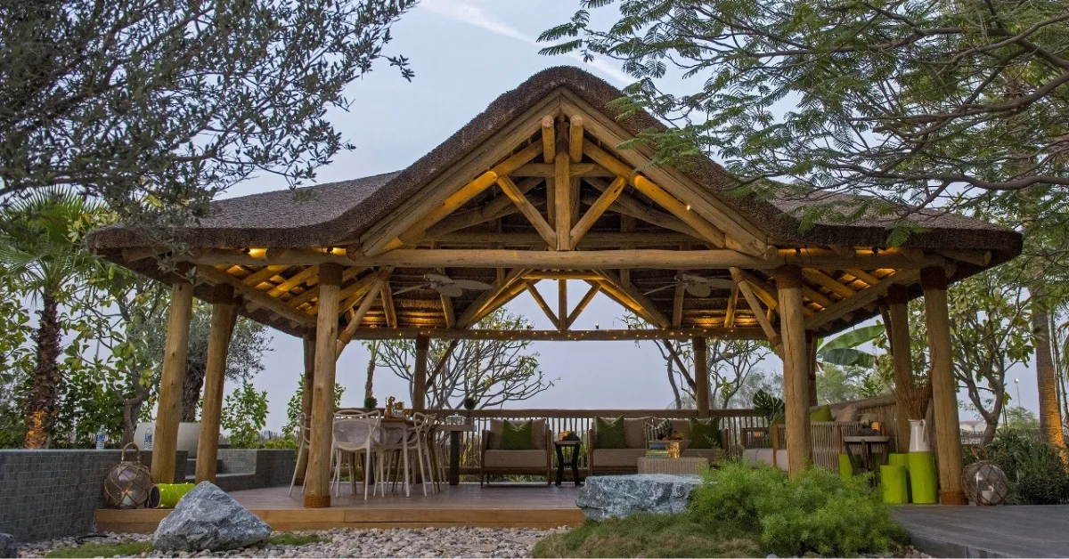 Elevate your outdoor space with our Ibiza thatched roof and timber structure with a gabled entrance.